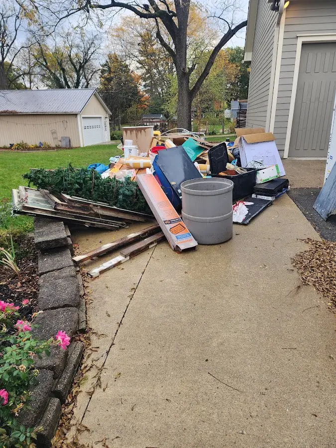 Dumpster being loaded with debris for Demolition Dumpster Rental in La Salle